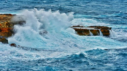 Waves splashing on rocks