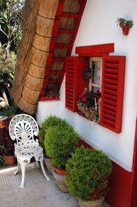 View of chair next to house window