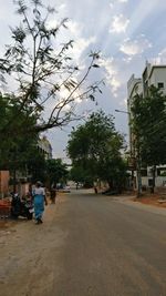 View of road in city against sky