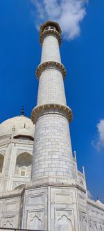 Low angle view of historic building against blue sky