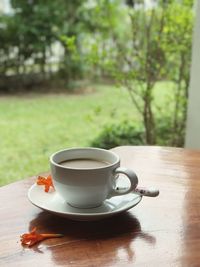 Close-up of coffee cup on table