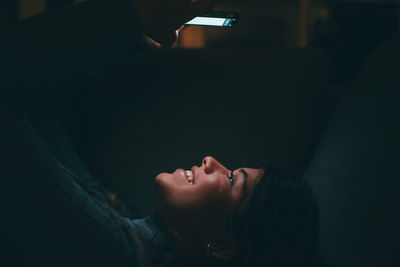 Low angle view of woman sitting at home