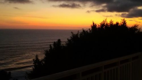 Scenic view of sea against sky at sunset