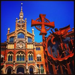 Low angle view of building against blue sky