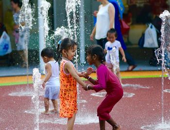 Group of people playing in water