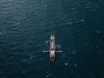 Aerial view of boat sailing in sea