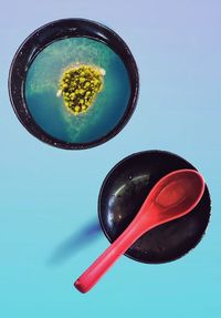 High angle view of ice cream on table against blue background