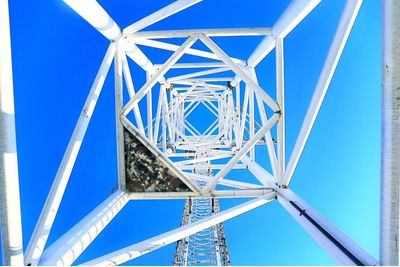 Low angle view of bridge against blue sky