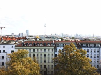 Buildings in city against sky