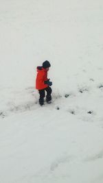 Man walking on snow field