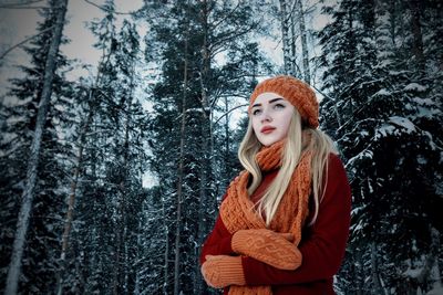 Beautiful woman in forest during winter