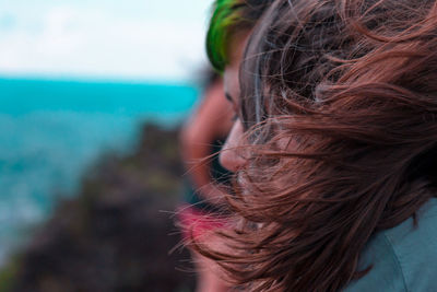 Close-up of woman with tousled hair