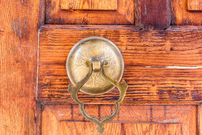 Directly above shot of door knocker on wall