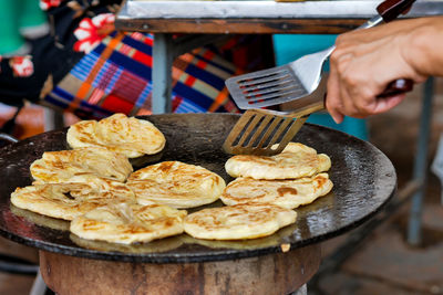 Close-up of man preparing food