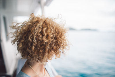 Portrait of woman against sea