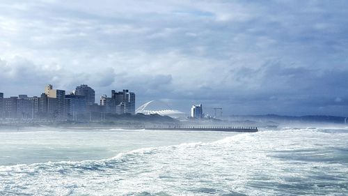 Sea with city in background