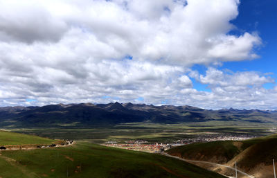 Scenic view of agricultural landscape against sky