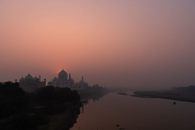 Scenic view of sea against clear sky during sunset