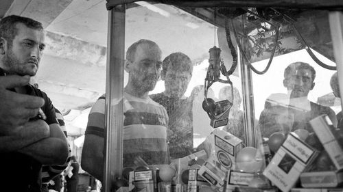 View of men on window