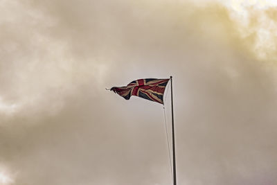 Low angle view of flag against sky