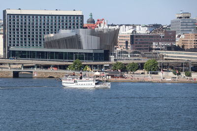 Scenic view of sea against sky in city