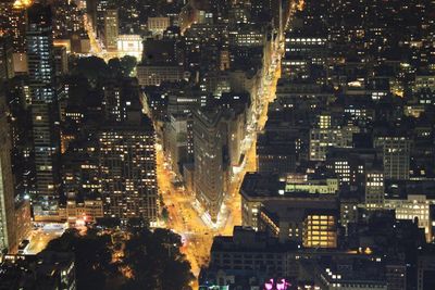 High angle view of illuminated city buildings at night