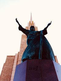 Low angle view of statue against building