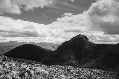 Scenic view of mountains against cloudy sky