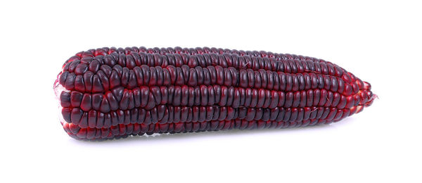 Close-up of red cake against white background