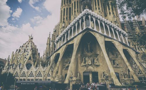 Low angle view of cathedral against cloudy sky