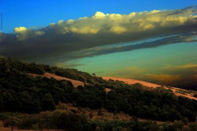 Scenic view of tree mountains against sky