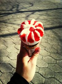 Cropped hand holding ice cream