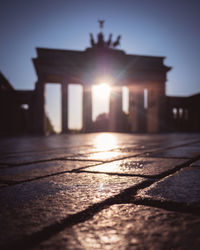 Sunlight falling on building against sky