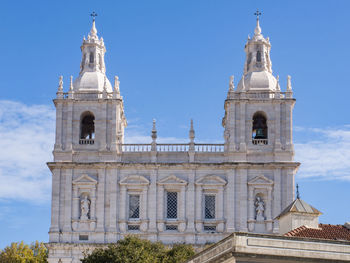 Church with two bell towers against a blue sky