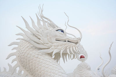 White chinese dragon decorated on a chinese dragon sculpture design background