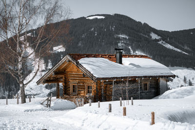 House on snow covered landscape