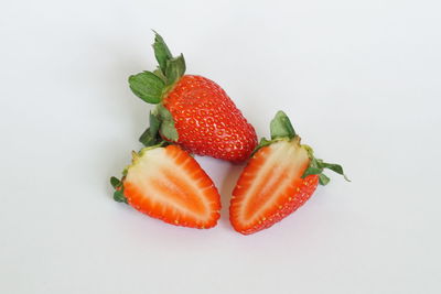 Close-up of strawberries on white background