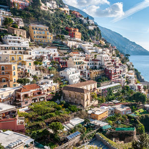 High angle view of townscape by sea