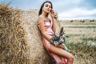 Young woman standing on field