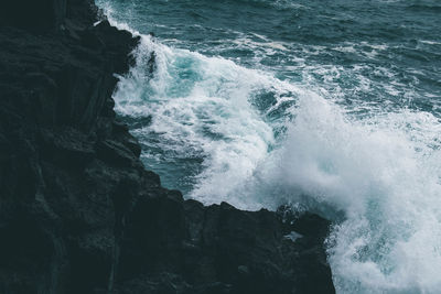 Waves splashing on rocks