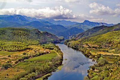Scenic view of landscape and mountains against sky