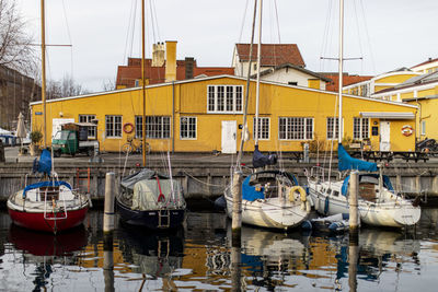 Boats moored at harbor