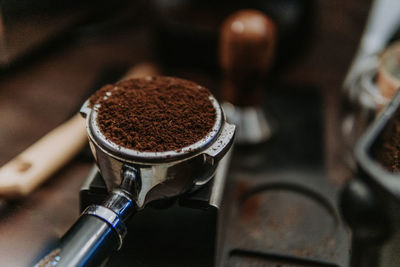 Close-up of ground coffee in container