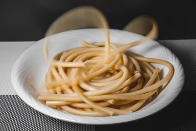 Close-up of noodles in plate on table