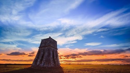 Castle against sky during sunset