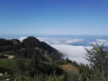 Scenic view of mountains against clear blue sky