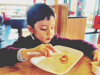 Close-up of boy eating food