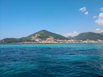 Scenic view of sea against blue sky