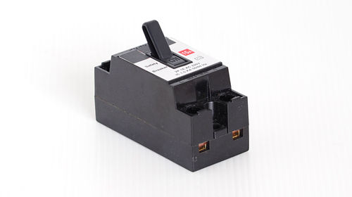 Close-up of telephone booth against white background