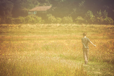 Full length of man standing on grassy field